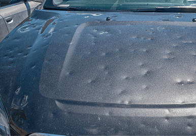 A car in Howell that received Hail damaged and needs body repair